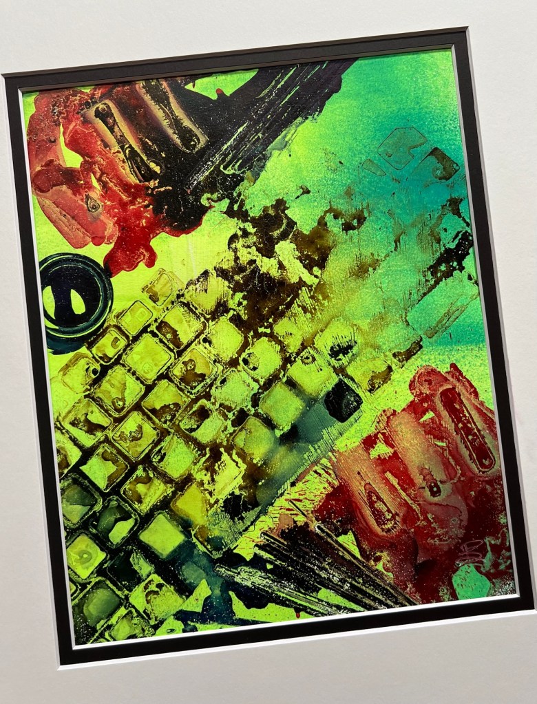 Alcohol Ink Monoprint, keyboard and pens. Greens, yellow with orange highlights